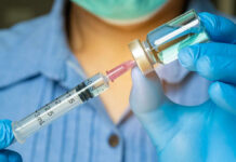 Rebel Zones Fuel Ebola Chaos in Congo Healthcare professional preparing a syringe from a vial