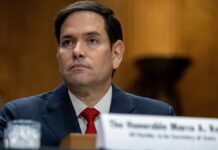 Rubio UNVEILS Bold Strait Plan—Will Allies Buckle? A government official sitting at a hearing with a serious expression