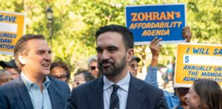 NYC Mayor’s Nakba Video Stirs Fiery Debate A politician speaking at a rally with supporters holding signs