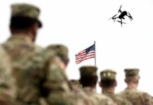 Explosive AI Move—SOCOM’s Secret Strategy Military personnel standing in formation with a drone flying overhead and an American flag in the background
