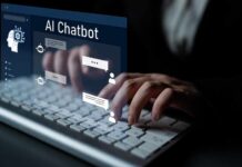 Person typing on a keyboard with a digital AI chatbot interface displayed