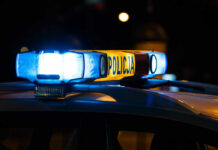 Massive Hunt in Romania: Boy Comes Home Safe Police car light bar glowing at night