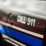 Person making an emergency call to 911 on a smartphone