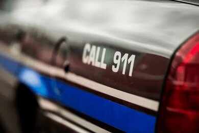 2643705463 Person making an emergency call to 911 on a smartphone