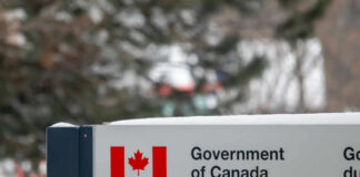 Americans Beg Canada For Safety Sign for the Government of Canada featuring the national flag and Health Canada
