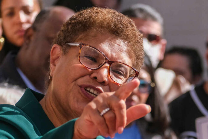 A political figure passionately speaking to a crowd with an expressive gesture