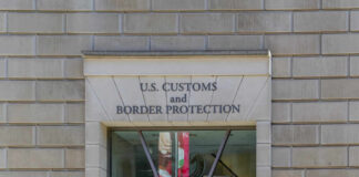 Fake Family Trick Turns Children Into Cargo Facade of the U.S. Customs and Border Protection building with signage