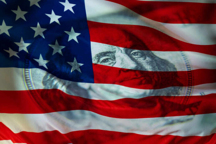 An American flag with a subtle overlay of a hundred-dollar bill