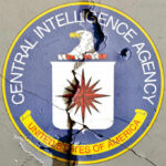 Cracked CIA logo on a wall
