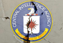 Cracked CIA logo on a wall