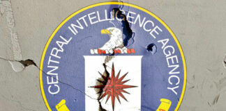 Cracked CIA logo on a wall