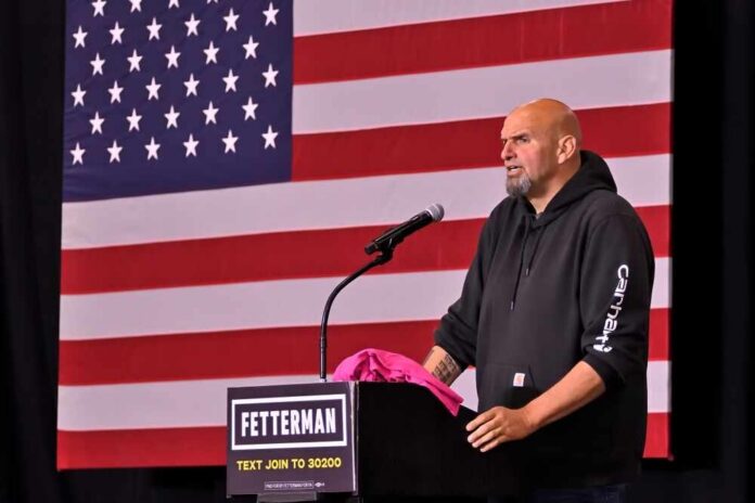 A speaker at a podium in front of an American flag during a political event