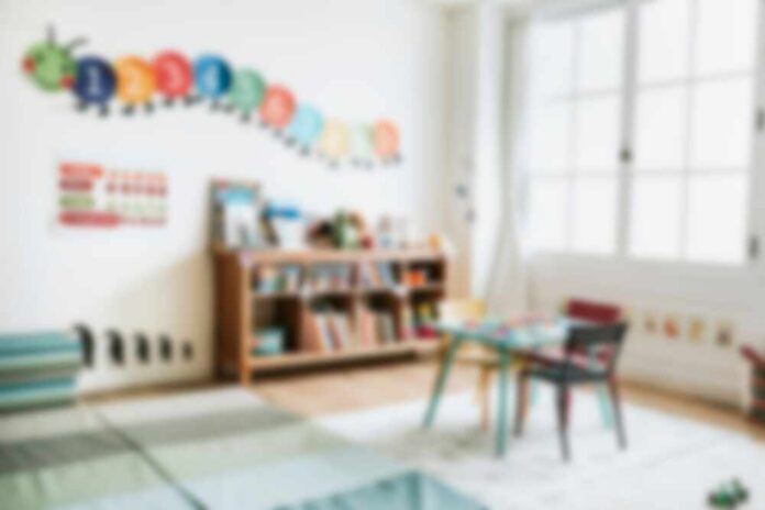 Bright,Classroom,With,Colorful,Decor,,Bookshelves,,And,Children's,Chairs.,Inviting A bright and colorful children's room with a bookshelf and a play table