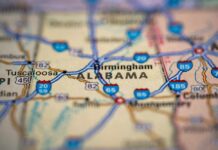 Close-up of a road map highlighting Alabama and nearby cities