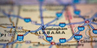 Close-up of a road map highlighting Alabama and nearby cities