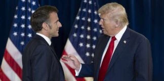 Why The Trump-Macron Claim Is Under Fire Two political leaders engaging in conversation with flags in the background
