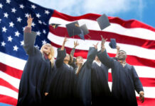 Mandatory DEI Ambush at 67% of Colleges Group of graduates joyfully throwing their caps in front of an American flag