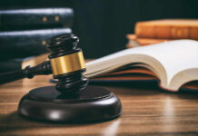 Outrage: Rapists Walk — No Detention Judge's gavel on desk with open law book