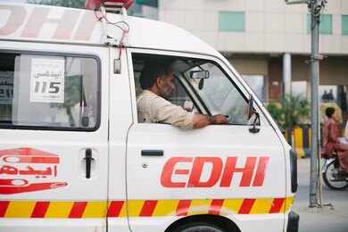 1439732558 Rescue workers search a collapsed building site