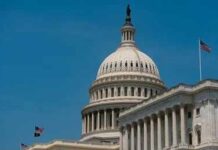 Inside Trump’s Latest Clemency Wave United States Capitol dome with American flags against a blue sky