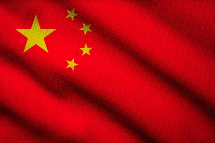 shutterstock2270863975jpg Close-up of the Chinese flag featuring a red background and yellow stars