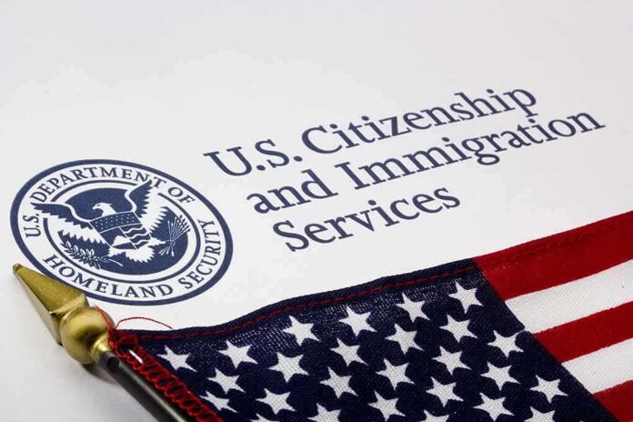 shutterstock_101132716 U.S. Citizenship and Immigration Services document with American flag