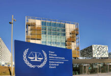International Criminal Court building with blue sign in front