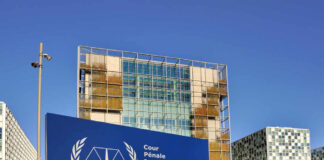 International Criminal Court building with blue sign in front