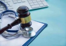 New Bill Could Transform Medical Lawsuits Gavel and stethoscope on medical clipboard near keyboard