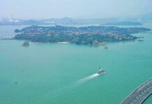Can ASEAN Stand Up To China? island with ferry and bridge in turquoise bay