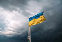 Ukrainian flag waving against a stormy sky