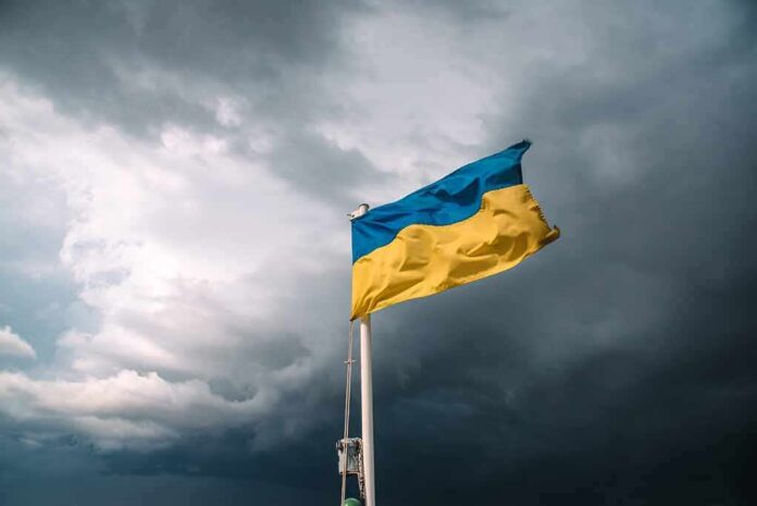 shutterstock_1653837706 Ukrainian flag waving against a stormy sky