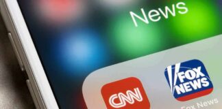 CNN Hype Collides With Court Reality smartphone screen showing CNN and Fox News app icons