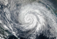 Extreme Storm Pounds U.S. Territory Satellite image of a hurricane swirling over the ocean