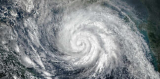 Extreme Storm Pounds U.S. Territory Satellite image of a hurricane swirling over the ocean