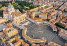 Rainbow Pilgrimage Marks Vatican First Aerial view of St. Peters Basilica and Vatican City with surrounding buildings
