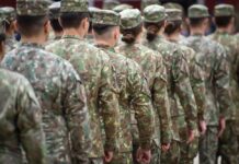 Military Justice System Still Questioned Line of soldiers in camouflage uniforms standing in formation