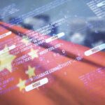 Overlay of programming code on a blurred Chinese flag