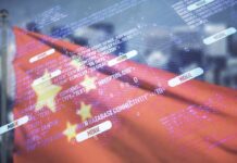 Weak Demand Hits China’s Economy Overlay of programming code on a blurred Chinese flag