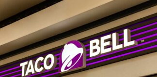 Parasite Outbreak Tied To Taco Bell Taco Bell storefront sign with purple bell logo
