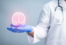 Kids’ “Fatal” Tumors Suddenly Vanish A medical professional holding a glowing digital brain illustration in their hand