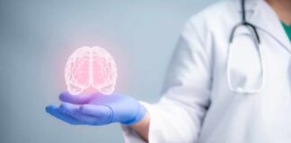 Kids’ “Fatal” Tumors Suddenly Vanish A medical professional holding a glowing digital brain illustration in their hand