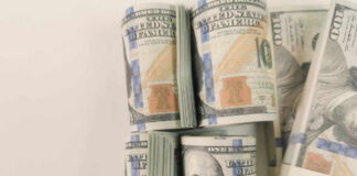 Stacks of hundred dollar bills arranged neatly