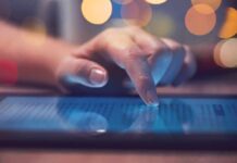 Online Rant Triggers Swift FBI Takedown Hand tapping a tablet screen