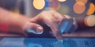 Online Rant Triggers Swift FBI Takedown Hand tapping a tablet screen