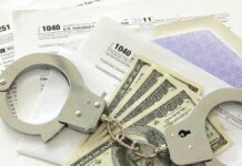 DOJ Drops Hammer On Suspended Rep Handcuffs on tax forms with cash