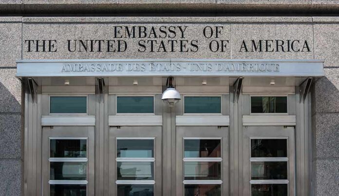 shutterstock_112985398 United States embassy entrance with metal doors and security camera
