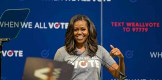 Michelle Obama’s Motherhood Comment Sparks Backlash woman speaking at a podium during a voting event