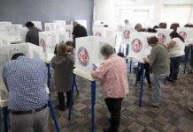 Maryland Targets Last GOP House Seat Voters fill out ballots at polling booths in a busy voting room