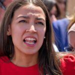 woman speaking passionately at outdoor event